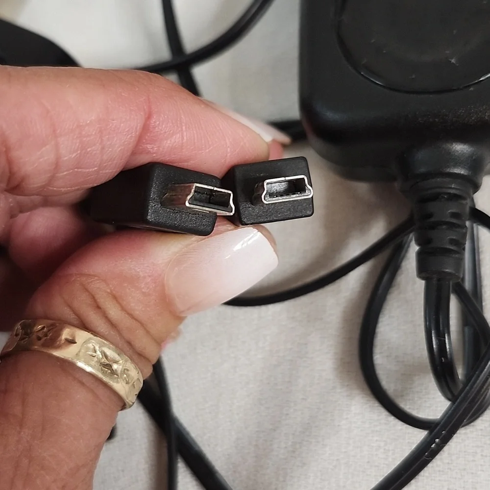 Assorted Vintage Electronic Charging Cables and Cases